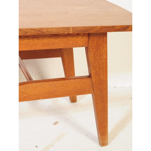 581 - British Modern Design - A mid 20th century circa 1960s teak Long John coffee table having shaped top... 