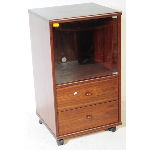583 - A contemporary mahogany veneered music audio record cabinet. Rectangular form with single glazed doo... 
