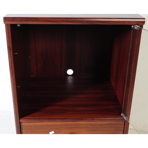 583 - A contemporary mahogany veneered music audio record cabinet. Rectangular form with single glazed doo... 