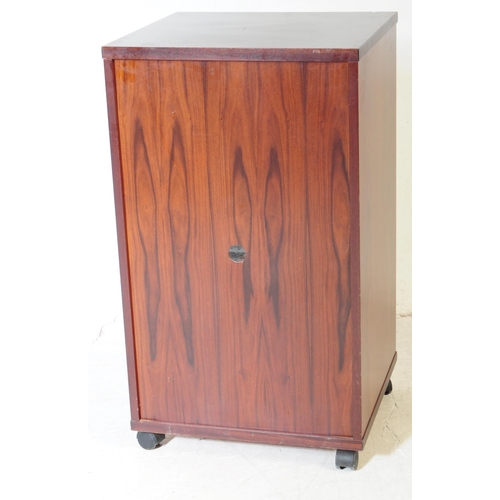583 - A contemporary mahogany veneered music audio record cabinet. Rectangular form with single glazed doo... 