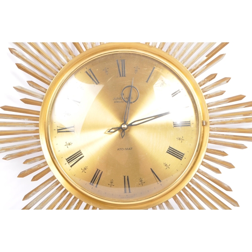 A vintage Ato Mat sunburst wall clock by Junghans Germany. Of