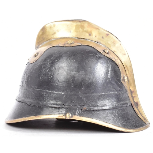 107 - A WWI First World War Imperial German / Prussian Fireman's helmet of brass and leather construction ... 