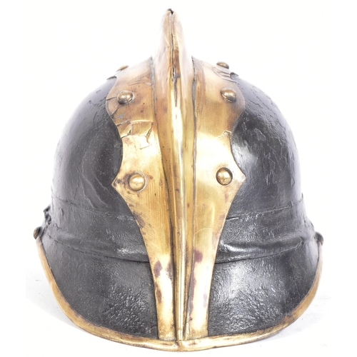 107 - A WWI First World War Imperial German / Prussian Fireman's helmet of brass and leather construction ... 