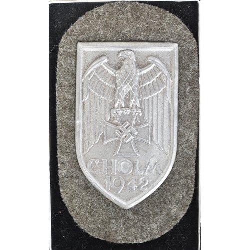 120 - A WWII Second World War Third Reich Nazi German Cholm / Kholm Campaign Shield. The silvered steel ba... 