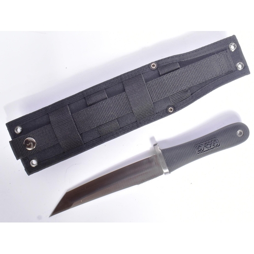 139 - An original American SOG made ' Tsunami ' knife model ST-01. Kraton grip with checkered texture and ... 