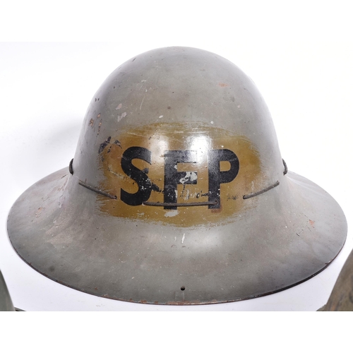 144 - A collection of WWII Second World War and later British Military helmets comprising; x2 Civil Defenc... 