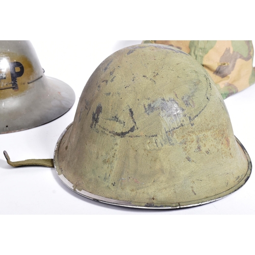 144 - A collection of WWII Second World War and later British Military helmets comprising; x2 Civil Defenc... 