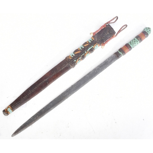 148 - A late 19th Century transitional Tuareg People ethnic sword. Tooled leather hilt and matching scabba... 