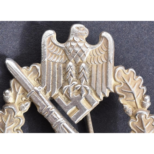 185 - A WWII Second World War Third Reich Nazi German Infantry Assault badge. The badge being a solid back... 