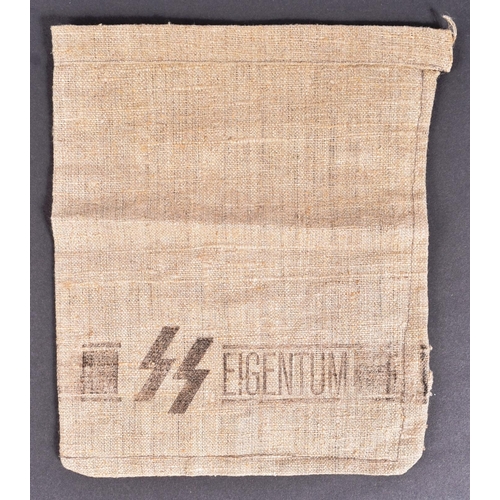 186 - A WWII Second World War Third Reich Nazi German Waffen SS armband along with a small SS linen sack s... 