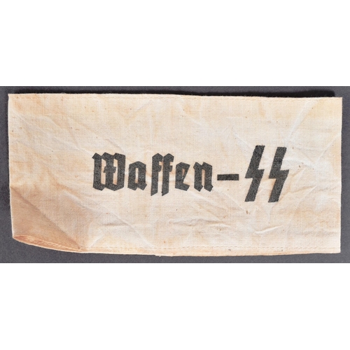 186 - A WWII Second World War Third Reich Nazi German Waffen SS armband along with a small SS linen sack s... 