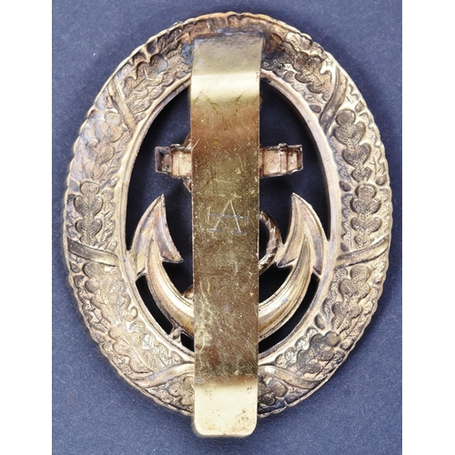 195 - A WWII Second World War Third Reich Nazi German Kriegsmarine Officer of the Watch badge. Gilt metal ... 