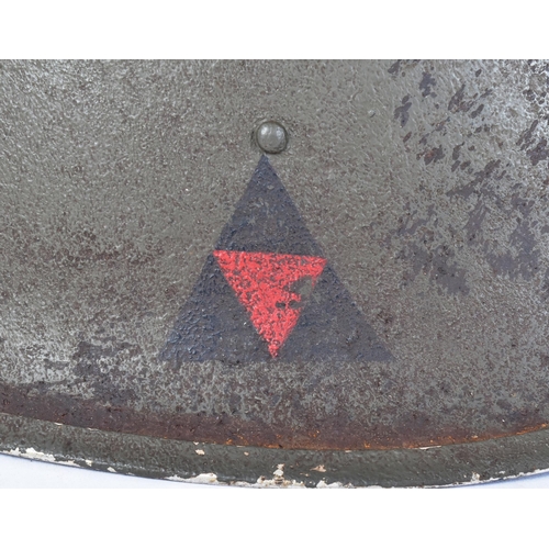 21 - A WWII Second World War British MKIII / 1944 pattern D Day helmet. Typical form with ' turtle ' shap... 