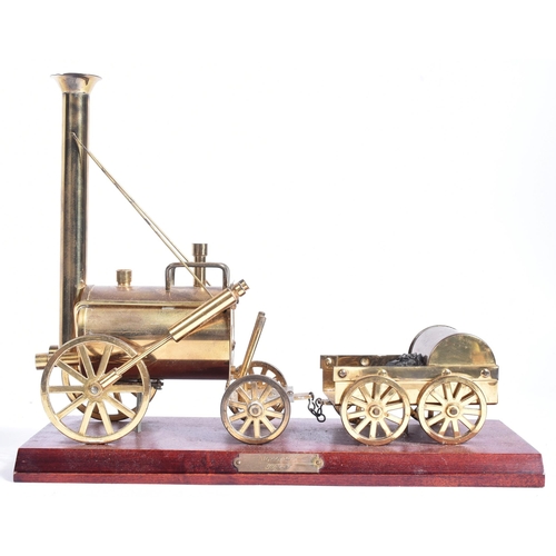 224 - Railwayana - a vintage brass Railway interest model of Stephenson's Rocket. The model well detailed,... 