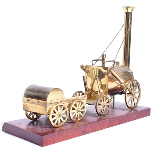 224 - Railwayana - a vintage brass Railway interest model of Stephenson's Rocket. The model well detailed,... 