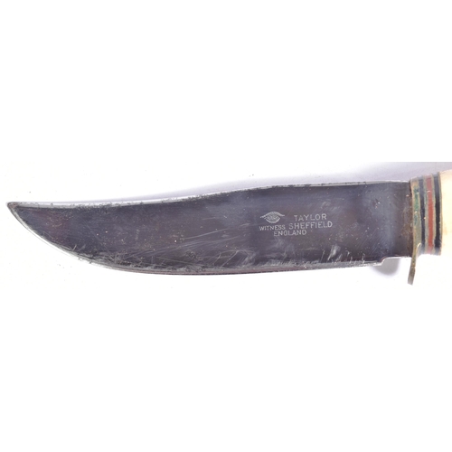 231 - A 20th century Taylor made ' Witness ' Bowie hunting type knife. Horn handled, with white metal supp... 