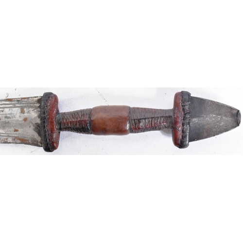 238 - An early 20th Century Central African arm held half sword. Exposed metal pommel with a clad leather ... 