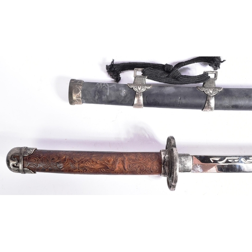 239 - A vintage Japanese Samurai Katana sword and a smaller matching Wakizashi. Each sword having a carved... 