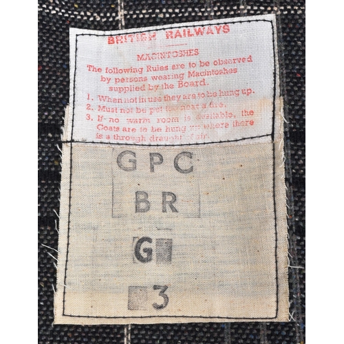 392 - A vintage British Railways double texture waterproof Mackintosh coat with double arrow buttons. Make... 