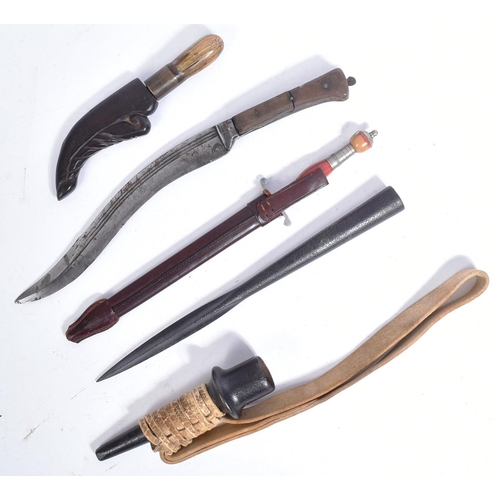 393 - A collection of assorted knives and daggers to include; a spear head with a cruciform section blade ... 