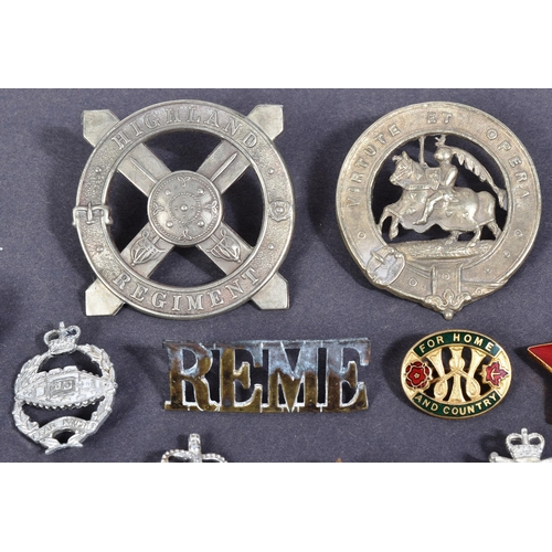 398 - A collection of assorted Military pins and cap badges to include; Highland Regiment, Scottish. 6th (... 