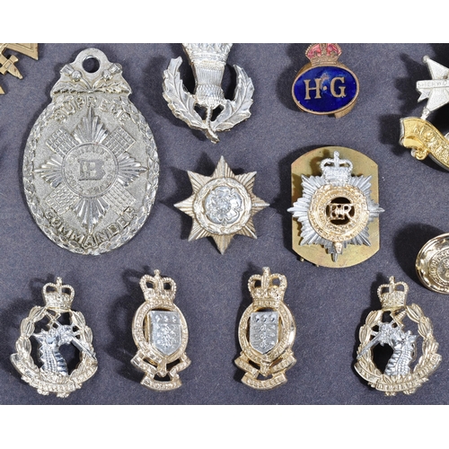 398 - A collection of assorted Military pins and cap badges to include; Highland Regiment, Scottish. 6th (... 