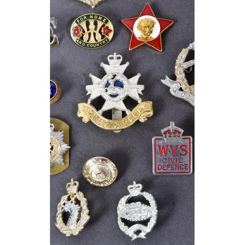 398 - A collection of assorted Military pins and cap badges to include; Highland Regiment, Scottish. 6th (... 