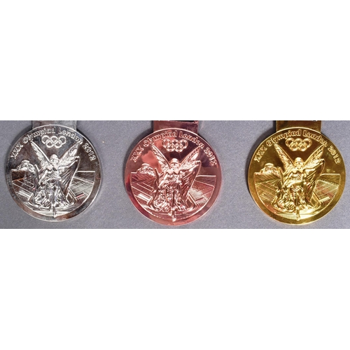 47 - London 2012 Olympic Games - a collection of x3 replica London Olympics medals comprising gold, silve... 