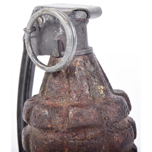 61 - A WWII Second World War US United States Army MK2 pineapple grenade. Cast iron grooved surface with ... 