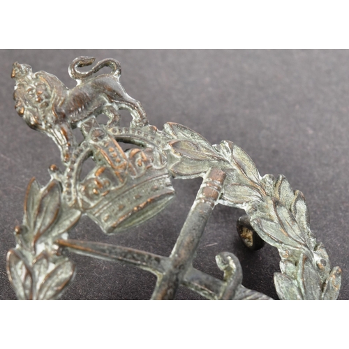 62 - A WWI First World War British Army Generals cap badge with a central crossed baton and sabre beneath... 