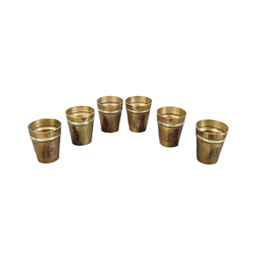 73 - A set of x6 WWII Second World War German Waffen SS Schnapps cups. Brass with engraved SS runes and r... 