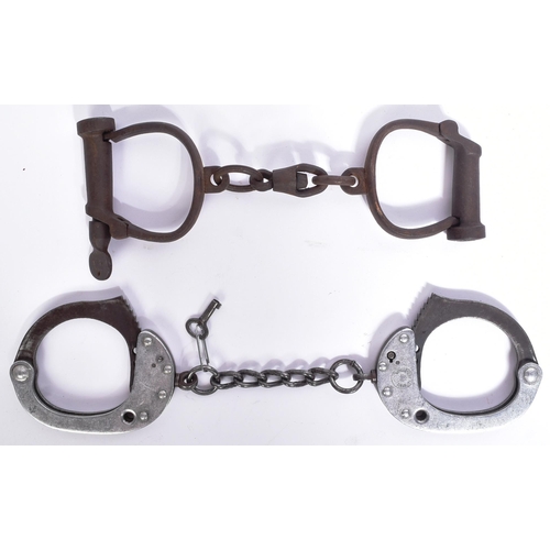 79 - Two 19th Century French Police handcuffs. The aluminium pair marked Gendarmerie Nationale with flami... 