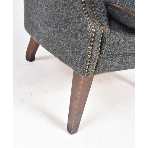 130 - Harris Tweed Mackenzie - A contemporary designer wingback fireside armchair. The chair having a mult... 