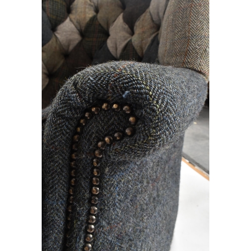 130 - Harris Tweed Mackenzie - A contemporary designer wingback fireside armchair. The chair having a mult... 