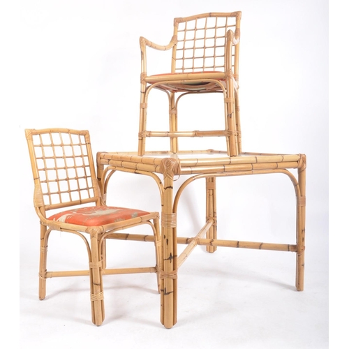 133 - A vintage 20th century bamboo dining / kitchen table and two chairs. The table of square from with i... 