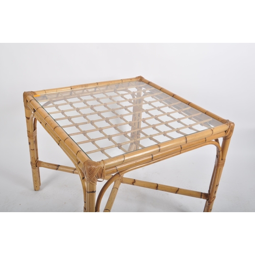 133 - A vintage 20th century bamboo dining / kitchen table and two chairs. The table of square from with i... 