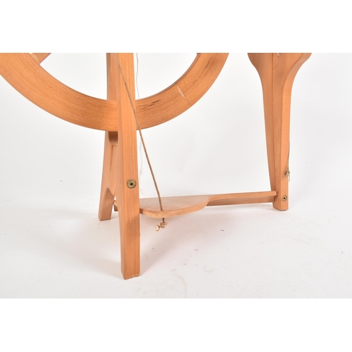 190 - Frank Herring & Sons - The Herring Spinning Wheel - A vintage 20th century beech bentwood floor spin... 