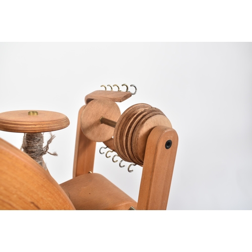 190 - Frank Herring & Sons - The Herring Spinning Wheel - A vintage 20th century beech bentwood floor spin... 