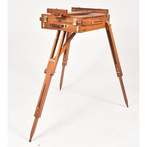 194 - A vintage 20th century folding collapsing architect's board / easel. The board raised on tapering su... 