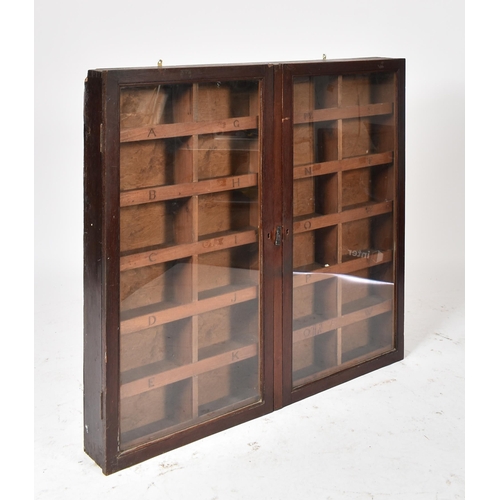 27 - A 19th century Victorian oak hanging library shop haberdashery cabinet. The cabinet having two full ... 