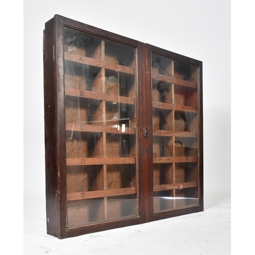 27 - A 19th century Victorian oak hanging library shop haberdashery cabinet. The cabinet having two full ... 