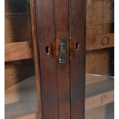 27 - A 19th century Victorian oak hanging library shop haberdashery cabinet. The cabinet having two full ... 