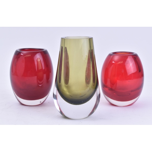 342 - Whitefriars - A selection of three retro 20th century glass vase. The lot comprising of two ruby red... 