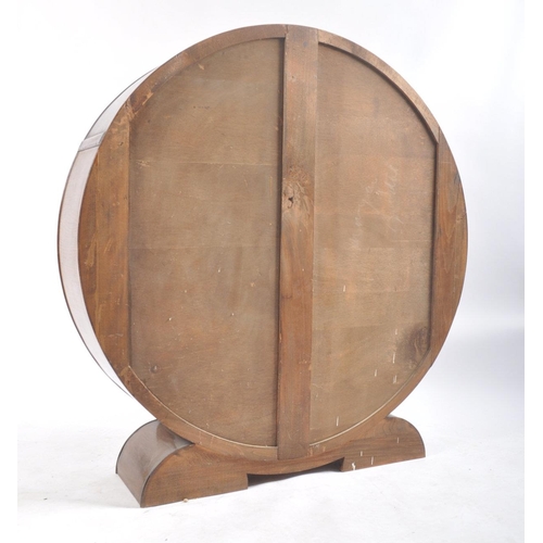 40 - A vintage 20th century 1930's Art Deco walnut display cabinet vitrine of circular form. The cabinet ... 