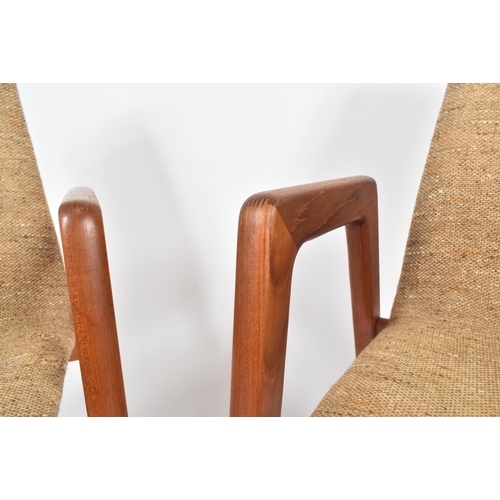 64 - Kai Kristiansen for Schou Andersen - A pair of retro mid 20th century Danish teak framed armchairs /... 