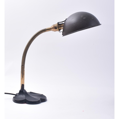 66 - A vintage 20th century Art Deco table / desk top lamp light. The lamp having a cup shade upon a bras... 