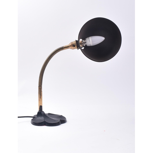 66 - A vintage 20th century Art Deco table / desk top lamp light. The lamp having a cup shade upon a bras... 