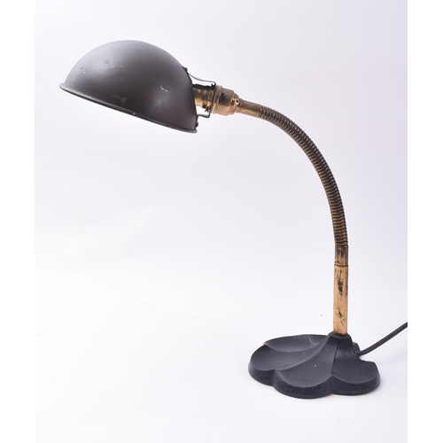 66 - A vintage 20th century Art Deco table / desk top lamp light. The lamp having a cup shade upon a bras... 