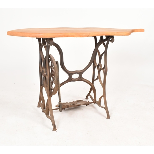 77 - A vintage 20th century converted cast iron sewing machine table / hall table. The table having an el... 