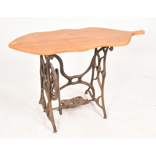 77 - A vintage 20th century converted cast iron sewing machine table / hall table. The table having an el... 